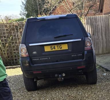 UK Number Plate 54 TG on a 2012 Black Land Rover Freelander