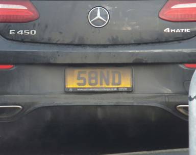 UK Number Plate 58 ND on a 2019 Black Mercedes-Benz E