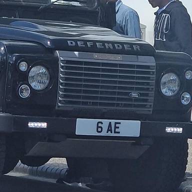 UK Number Plate 6 AE on a 2011 Black Land Rover Defender
