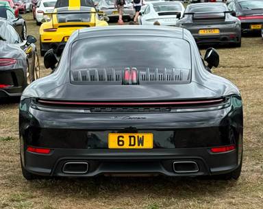 UK Number Plate 6 DW on a 2024 Black Porsche 911 Carrera S-A
