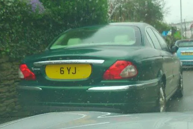 UK Number Plate 6 YJ on a 2004 Green Jaguar X-Type
