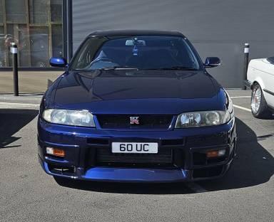 UK Number Plate 60 UC on a 1998 Blue Nissan Skyline
