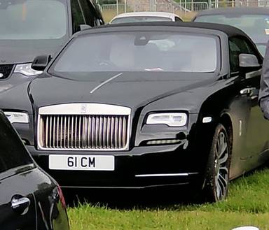 UK Number Plate 61 CM on a 2019 Black Rolls Royce Dawn