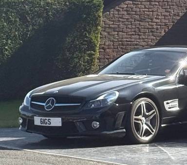 UK Number Plate 61 GS on a 2009 Black Mercedes SL
