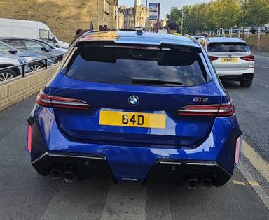 UK Number Plate 64 D on a 2025 Blue BMW M5 Phev Auto