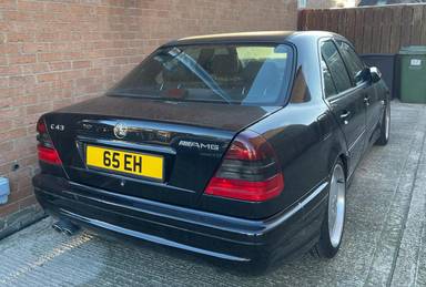 UK Number Plate 65 EH on a 1999 Black Mercedes C