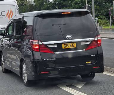 UK Number Plate 68 EE on a 2012 Black Toyota Alphard V6