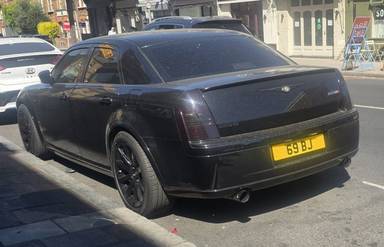 UK Number Plate 69 BJ on a 2006 Black Chrysler 300