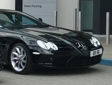 UK Number Plate 69 HG on a 2008 Black Mercedes SLR