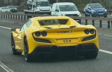 UK Number Plate 69 M on a 2021 Yellow Ferrari F8 Spider S-A