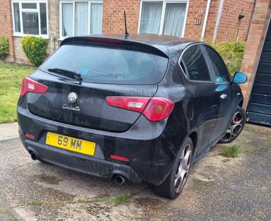 UK Number Plate 69 MM on a 2011 Black Alfa Romeo