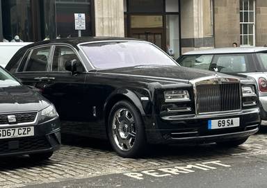 UK Number Plate 69 SA on a 2015 Black Rolls Royce Phantom