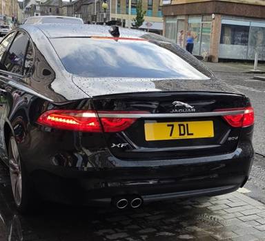 UK Number Plate 7 DL on a 2019 Black Jaguar XF