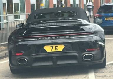 UK Number Plate 7 E on a 2026 Black Porsche 911 Turbo S Hev S-A