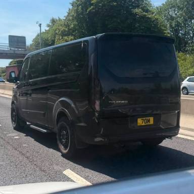 UK Number Plate 7 OM on a 2018 Black Ford Tourneo