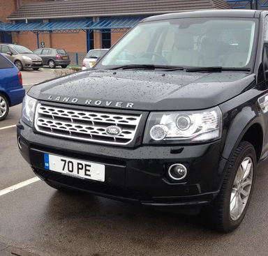 UK Number Plate 70 PE on a 2013 Black Land Rover Freelander