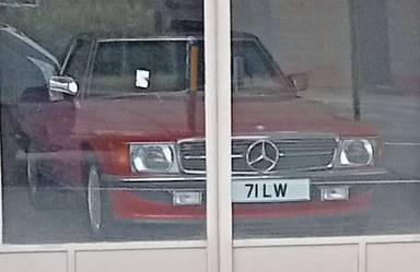 UK Number Plate 71 LW on a 1989 RED Mercedes 300