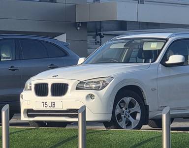 UK Number Plate 75 JB on a 2011 White BMW X1