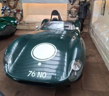 UK Number Plate 76 NO on a 1957 Green Jaguar