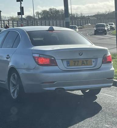 UK Number Plate 77 AT on a 2009 Silver BMW 520