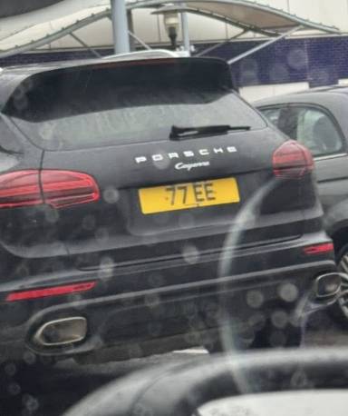 UK Number Plate 77 EE on a 2015 Black Porsche Cayenne