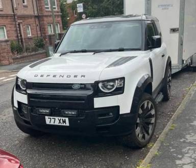 UK Number Plate 77 XM on a 2021 White Land Rover Defender Hard Top D Mhev Auto