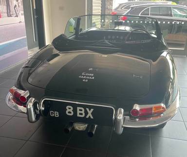 UK Number Plate 8 BX on a 1966 Green Jaguar E-Type