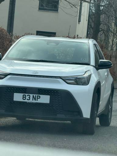 UK Number Plate 83 NP on a 2026 White Toyota Aygo X Icon Hev Auto
