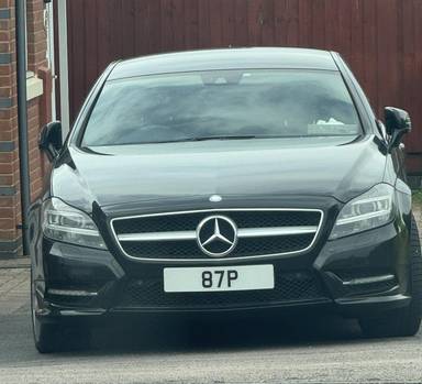 UK Number Plate 87 P on a 2013 Black Mercedes-Benz CLS
