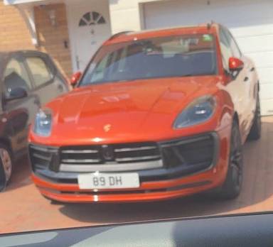 UK Number Plate 89 DH on a 2024 Orange Porsche Macan