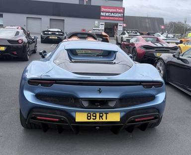 UK Number Plate 89 RT on a 2024 Blue Ferrari 296 Gts S-A