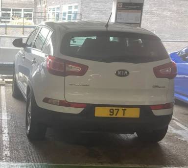 UK Number Plate 97 T on a 2013 White KIA Sportage
