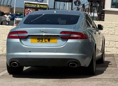 UK Number Plate 99 CW on a 2011 Blue Jaguar XF