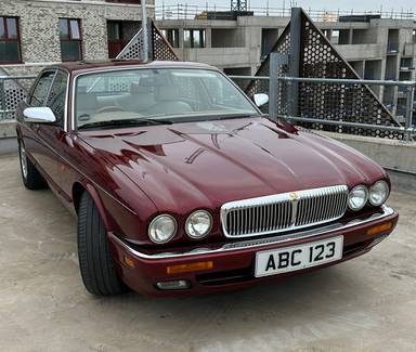 UK Number Plate ABC 123 on a 1995 RED Daimler Six Auto