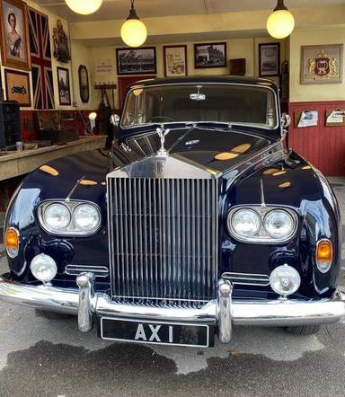 UK Number Plate AX 1 on a Blue Rolls Royce Phantom