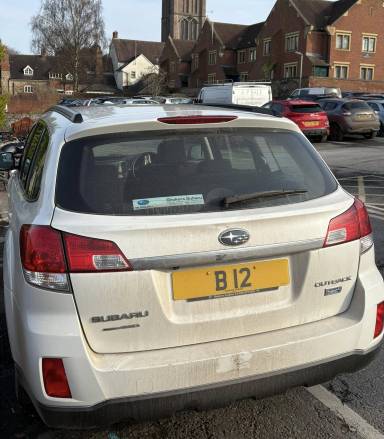 UK Number Plate B 12 on a 2013 White Subaru Outback