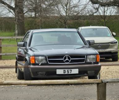 UK Number Plate D 57 on a 1987 Black Mercedes 560