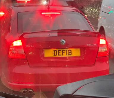 UK Number Plate DEF 1B on a 2011 RED Skoda Octavia