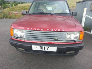UK Number Plate DH 7 on a 1997 RED Land Rover Range Rover
