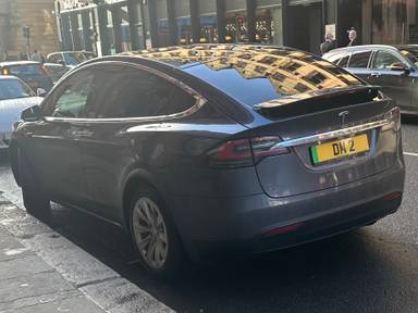 UK Number Plate DM 2 on a 2019 Grey Tesla Model X