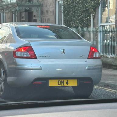 UK Number Plate DN 4 on a 2011 Silver Peugeot 407