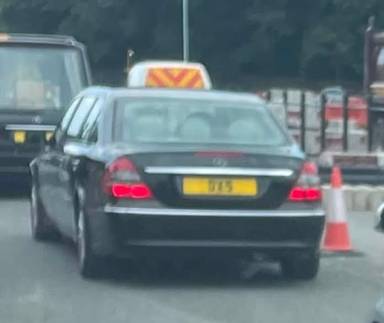 UK Number Plate DX 5 on a 2007 Black Mercedes E