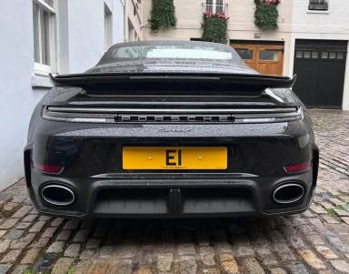 UK Number Plate E 1 on a 2026 Black Porsche 911 Turbo S Hev S-A
