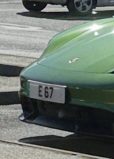 UK Number Plate E 67 on a 2021 Green Porsche Taycan Turbo S