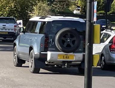 UK Number Plate E 82 on a 2022 Blue Land Rover Defender S D Mhev Auto