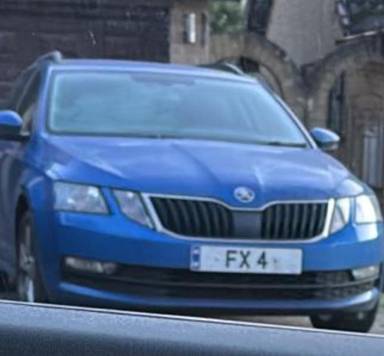 UK Number Plate FX 4 on a 2020 Blue Skoda Octavia
