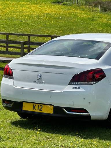 UK Number Plate K 12 on a 2016 White Peugeot 508