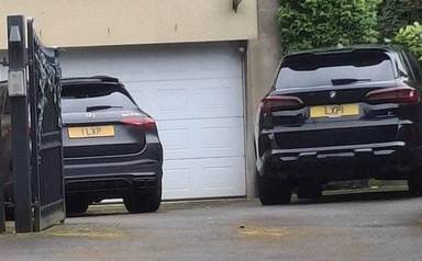UK Number Plate LXP 1 on a 2022 Black BMW