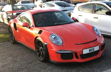 UK Number Plate MX 6 on a 2015 Orange Porsche 911