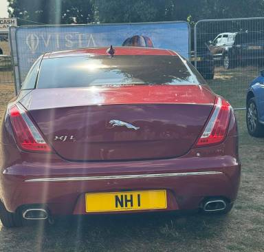 UK Number Plate NH 1 on a 2014 RED Jaguar XJ